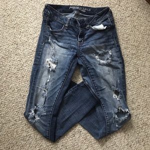 Mid Rise Ripped Skinny Jeans